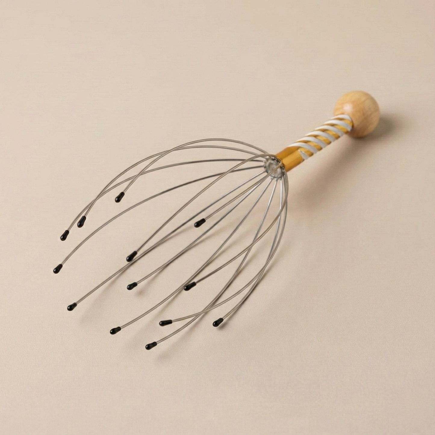 Soma Rituals handheld scalp massager with soft bristles